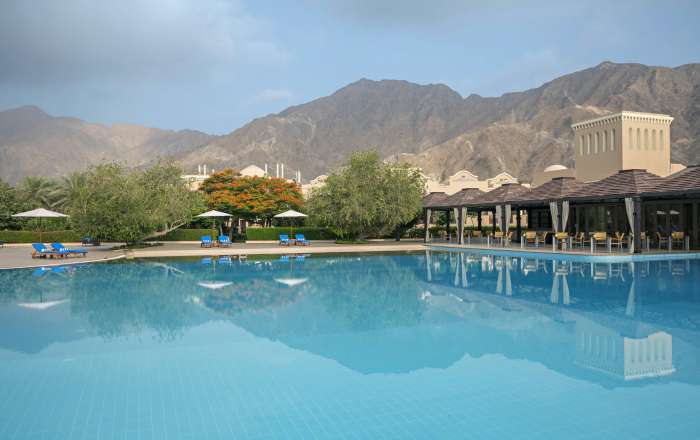 Relax Poolside in the Shadow of the Mountains