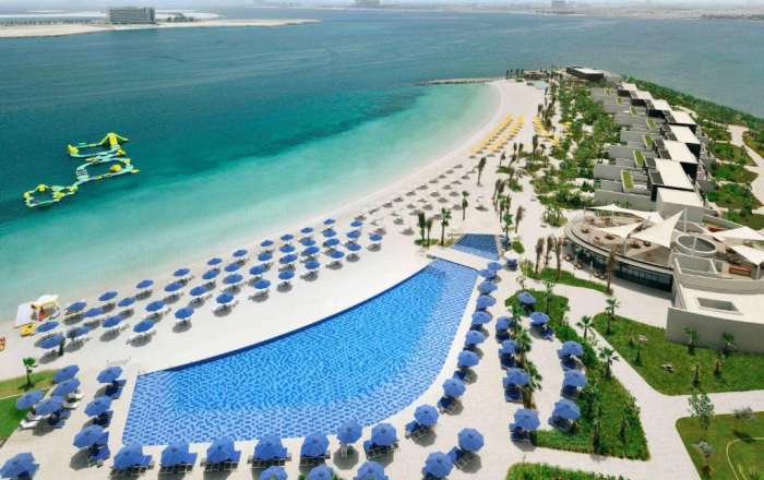 Aerial Shot of the Beaufitul Beachfront and Floating Splash Park