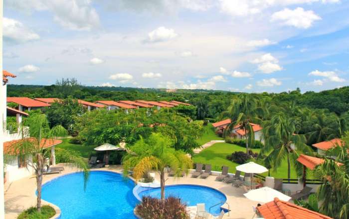 Aerial views towards hotel pool, gardens & accommodations