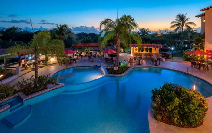 Aerial shot of hotel pool, including poolside dining & bar