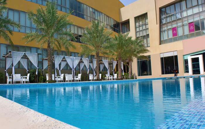 Resort Pool Offset by Sun Loungers