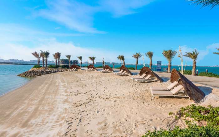 Pull up a sun lounger on a private stretch of golden sand