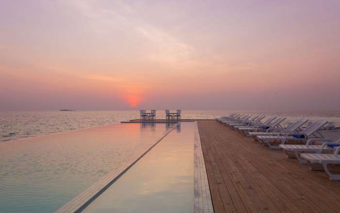 Enjoy a Sunset From the Infinity Pool