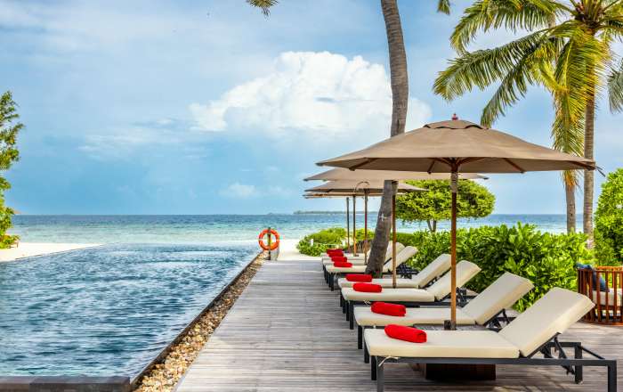 Lounge by the Infinity Pool Overlooking the Beach