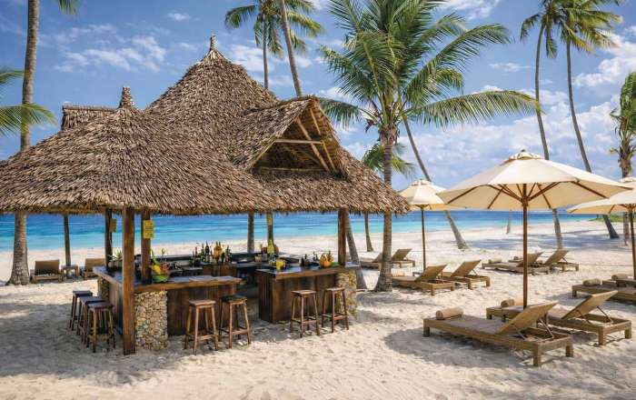 Grab your favourite cocktail from the UPEPO beach bar